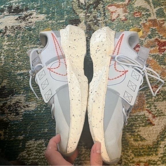 Gray Nike athletic shoes with splatter paint main image 10